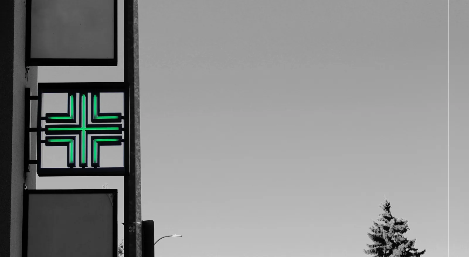Penny Fausta Pharmacy storefront sign in West Hillhurst