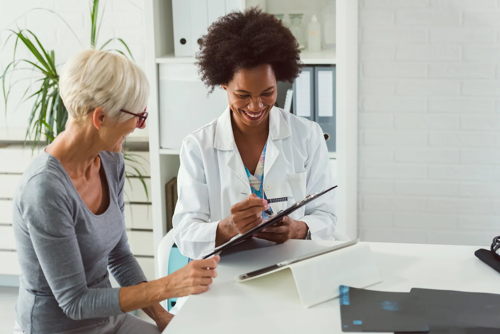 Patient speaking with a healthcare professional during a private consultation